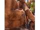 A close view of a decorative rock waterfall feature in a tranquil community setting at 12222 N Paradise Village S Pkwy # 442, Phoenix, AZ 85032