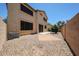Spacious backyard featuring a brick patio and rock landscaping at 125 N 22 Pl # 14, Mesa, AZ 85213