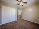 Comfortable bedroom showcases a closet and neutral color scheme with carpeting at 125 N 22 Pl # 14, Mesa, AZ 85213