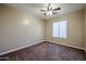 Bedroom featuring carpet, neutral walls, and a modern ceiling fan at 125 N 22 Pl # 14, Mesa, AZ 85213