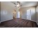 Neutral bedroom featuring carpet, vaulted ceiling, a ceiling fan, and an ensuite bathroom and closet at 125 N 22 Pl # 14, Mesa, AZ 85213