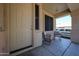 Covered front porch with chairs provides a welcoming outdoor sitting area at 125 N 22 Pl # 14, Mesa, AZ 85213