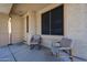Inviting front porch featuring two chairs and a large window at 125 N 22 Pl # 14, Mesa, AZ 85213