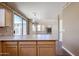 This kitchen boasts bar seating and views of the backyard and fireplace at 125 N 22 Pl # 14, Mesa, AZ 85213