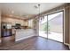 Eat-in kitchen features stainless appliances and a sliding glass door to the yard at 125 N 22 Pl # 14, Mesa, AZ 85213