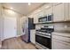 Updated kitchen features stainless steel appliances and a gas cooktop at 125 N 22 Pl # 14, Mesa, AZ 85213