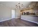This dining area boasts wood-look tile and a kitchen view with stainless appliances at 125 N 22 Pl # 14, Mesa, AZ 85213
