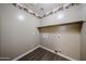 Laundry room with tile flooring and storage shelf at 125 N 22 Pl # 14, Mesa, AZ 85213