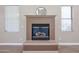 Close-up of the fireplace with a mantel and tile surround at 125 N 22 Pl # 14, Mesa, AZ 85213