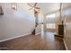 Spacious living room featuring a ceiling fan, tile floors, and a staircase at 125 N 22 Pl # 14, Mesa, AZ 85213