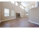 Open living room showcasing tall windows, a fireplace and tile flooring at 125 N 22 Pl # 14, Mesa, AZ 85213