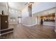 Bright living room with tile floors flowing into the kitchen at 125 N 22 Pl # 14, Mesa, AZ 85213