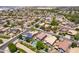 Wide aerial perspective showcasing a vibrant community with well-maintained homes and landscaping at 13709 W Rovey Ave, Litchfield Park, AZ 85340