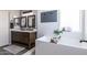 Beautiful bathroom with double sinks and a modern soaking tub, creating a luxurious retreat at 13709 W Rovey Ave, Litchfield Park, AZ 85340