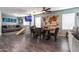 Open concept dining area with modern furnishings and a wooden world map, perfect for Gathering meals and gatherings at 13709 W Rovey Ave, Litchfield Park, AZ 85340