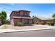 Cozy two-story home with low-maintenance desert landscaping and clean curb appeal at 13709 W Rovey Ave, Litchfield Park, AZ 85340