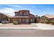 Charming two-story home with a well-maintained front yard and covered porch entryway at 13709 W Rovey Ave, Litchfield Park, AZ 85340
