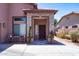 Inviting front porch with decorative stone accents and a charming wreath on the front door at 13709 W Rovey Ave, Litchfield Park, AZ 85340
