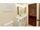 Updated bathroom featuring a modern vanity with gold fixtures, decorative mirror and tile floors at 14910 N Kings Way # 105, Fountain Hills, AZ 85268