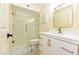 Beautifully updated bathroom with a glass shower, modern vanity with gold fixtures and tile floors at 14910 N Kings Way # 105, Fountain Hills, AZ 85268