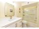 Bright bathroom featuring a white vanity with gold fixtures and a bathtub with glass doors at 14910 N Kings Way # 105, Fountain Hills, AZ 85268