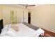 Comfortable main bedroom featuring hardwood floors, double door closet and an ensuite bathroom at 14910 N Kings Way # 105, Fountain Hills, AZ 85268