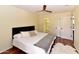 Comfortable main bedroom featuring hardwood floors, double door closet and an ensuite bathroom at 14910 N Kings Way # 105, Fountain Hills, AZ 85268