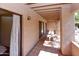 Covered patio with tile floors and a porch swing at 14910 N Kings Way # 105, Fountain Hills, AZ 85268