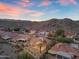 Aerial shot showcasing the community with red tile roofs against a desert backdrop at 15232 S 36Th Pl, Phoenix, AZ 85044