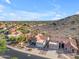 An aerial of a neighborhood nestled against a mountain with sprawling desert views at 15232 S 36Th Pl, Phoenix, AZ 85044