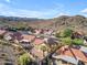 Aerial view featuring desert landscaping, tile roofs, and stunning mountain views at 15232 S 36Th Pl, Phoenix, AZ 85044