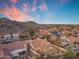Aerial view of a property in a desert community with mountain views at 15232 S 36Th Pl, Phoenix, AZ 85044
