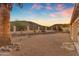 Backyard with desert landscaping and mountain views at dusk at 15232 S 36Th Pl, Phoenix, AZ 85044