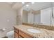 Modern bathroom featuring a vanity with granite counters, sink and a large mirror at 15232 S 36Th Pl, Phoenix, AZ 85044