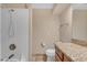 Bright bathroom featuring a tub and shower combination, with tiled walls at 15232 S 36Th Pl, Phoenix, AZ 85044