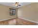 Bedroom with sleek, wood-look floors and a large window with a view at 15232 S 36Th Pl, Phoenix, AZ 85044