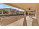 Covered patio with desert landscaping in the backyard with mountain views at 15232 S 36Th Pl, Phoenix, AZ 85044