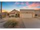 Inviting single-Gathering home featuring a tile roof, a two-car garage, and desert landscaping at 15232 S 36Th Pl, Phoenix, AZ 85044
