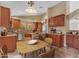 Modern kitchen with wood cabinets, tile backsplash, granite countertops, and stainless steel appliances at 15232 S 36Th Pl, Phoenix, AZ 85044