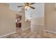 Bright living room with ceiling fan, neutral walls and tile flooring at 15232 S 36Th Pl, Phoenix, AZ 85044