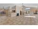 Bright, airy living room with tile flooring, fireplace, and French doors to the outdoor space at 15232 S 36Th Pl, Phoenix, AZ 85044