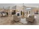 Spacious living room featuring tile floors, high ceilings, and a cozy fireplace at 15232 S 36Th Pl, Phoenix, AZ 85044