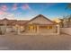 Back exterior with desert landscaping, covered patio, and views of the surrounding desert community at 15232 S 36Th Pl, Phoenix, AZ 85044