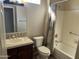 Standard bathroom features a single sink vanity and a tub and shower combination at 15314 W Camino Estrella Dr, Surprise, AZ 85374