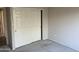 Cozy bedroom featuring closet with paneled sliding doors at 15314 W Camino Estrella Dr, Surprise, AZ 85374