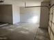 Garage features bright lighting and ample space at 15314 W Camino Estrella Dr, Surprise, AZ 85374