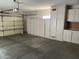Spacious garage featuring cabinets for additional storage at 15314 W Camino Estrella Dr, Surprise, AZ 85374