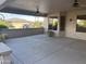 Spacious covered patio features two ceiling fans at 15314 W Camino Estrella Dr, Surprise, AZ 85374