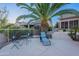Serene backyard featuring a cozy seating area, mature trees, and lush landscaping at 16333 E Crystal Point Dr, Fountain Hills, AZ 85268