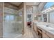 Elegant bathroom featuring a walk-in shower, double vanity, and neutral tile flooring at 16333 E Crystal Point Dr, Fountain Hills, AZ 85268